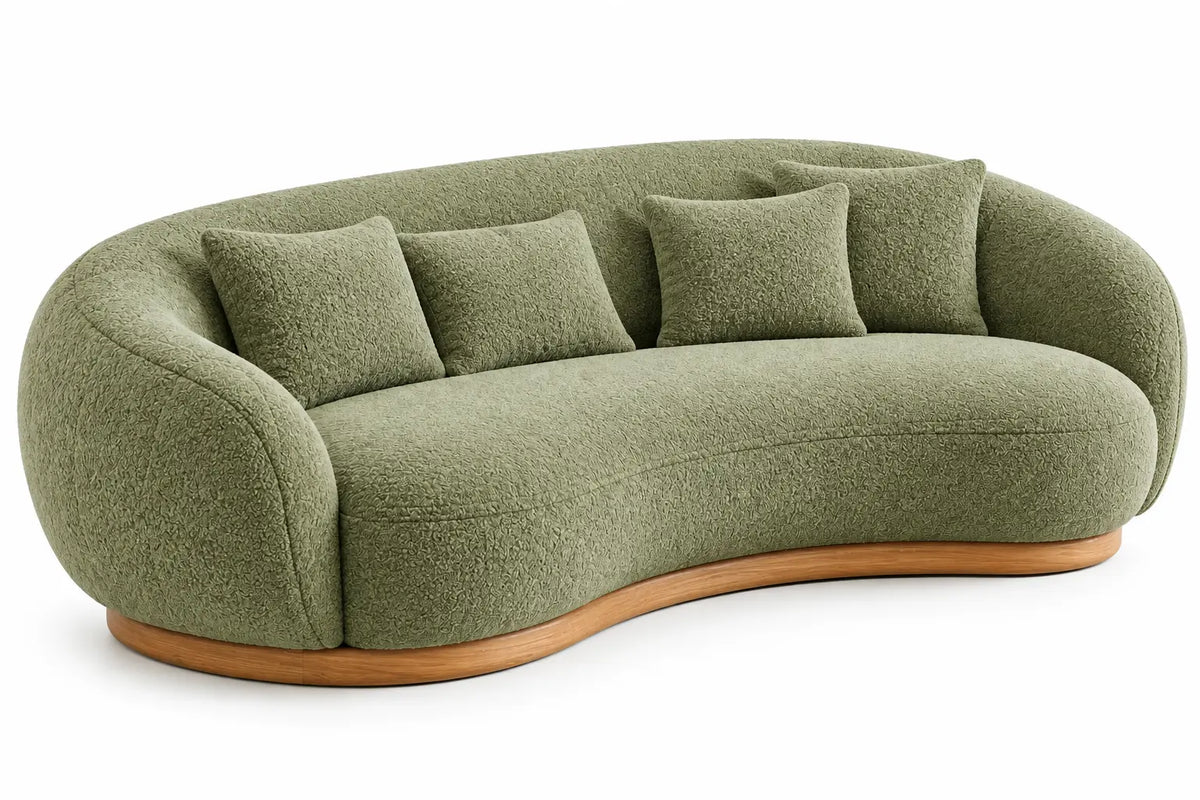 Canapé vert courbé à dossier enveloppant et socle beige